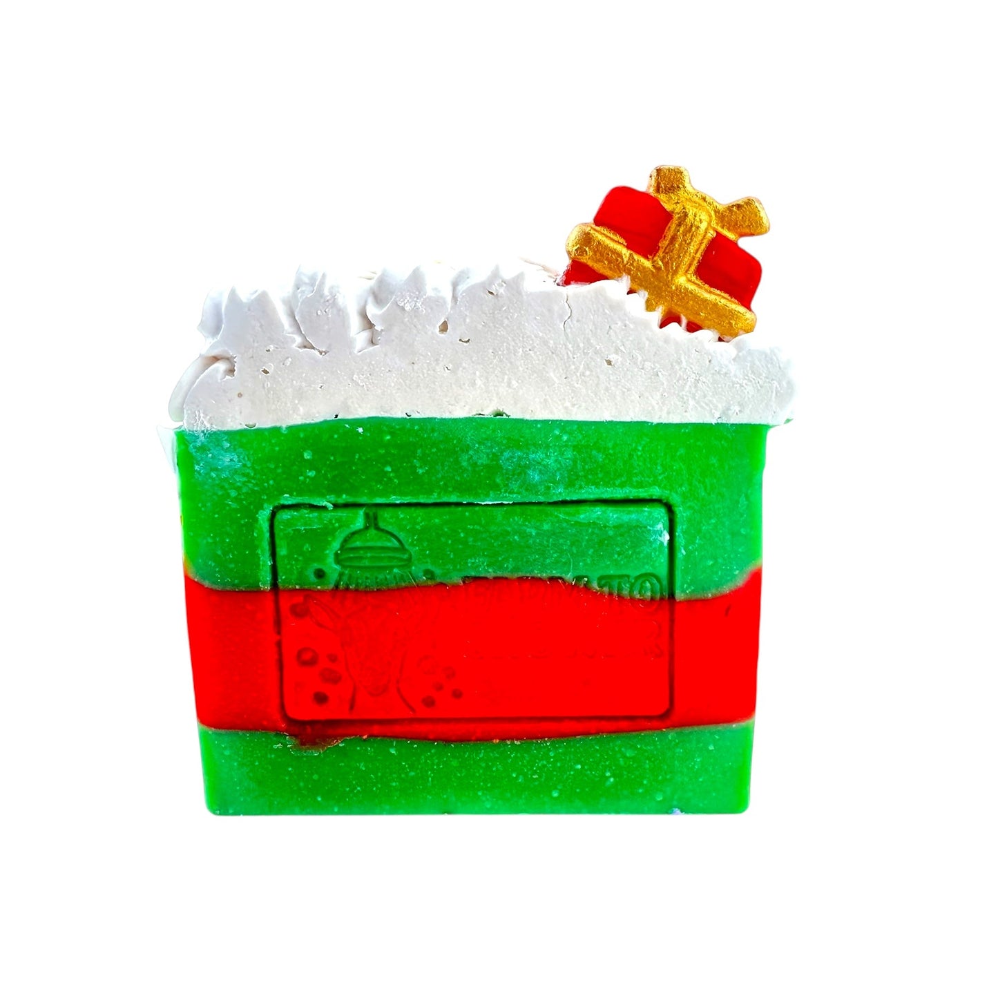 Decorative soap bar with green and red design, resembling a present, on a white background.