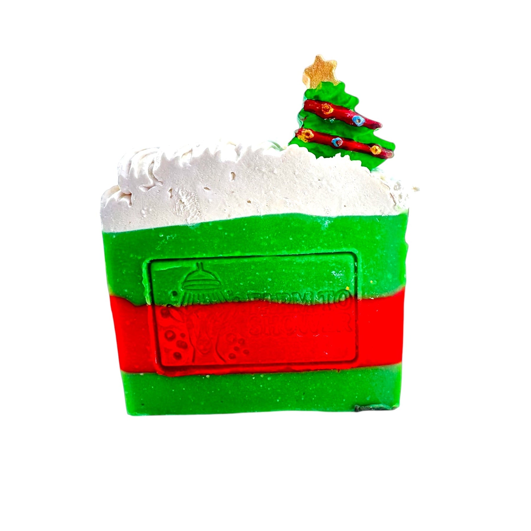 Christmas-themed soap with a tree on top against a white background